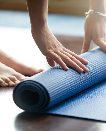 woman with yoga mat